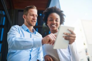 Man and Woman reading a pad of paper